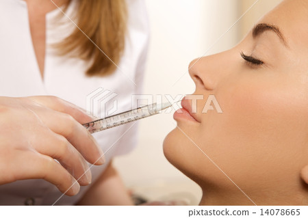 young beautiful woman having an injection young beautiful woman having an injection 14078665