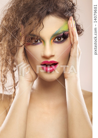young attracive female face with multicolored make-up young attracive female face with multicolored make-up 14079681