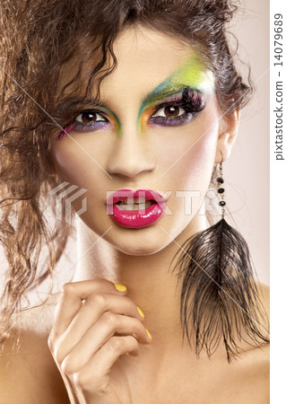 young attracive female face with multicolored make-up young attracive female face with multicolored make-up 14079689