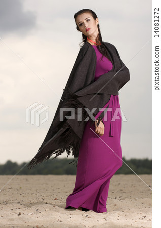 Sexy brunette posing in violet dress. Sexy brunette posing in violet dress. 14081272