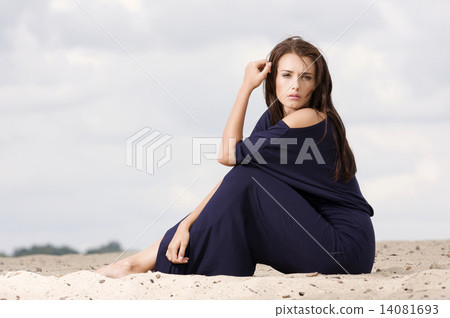 Sexy brunette posing in violet dress. Sexy brunette posing in violet dress. 14081693