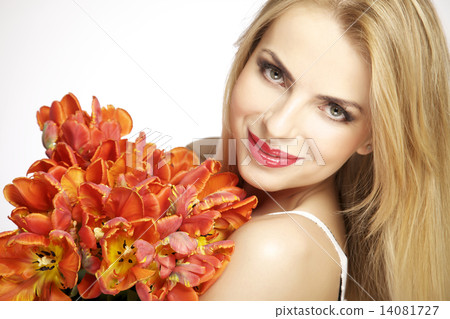 Beautiful blonde girl with the bouquet of tulips isolated on a w Beautiful blonde girl with the bouquet of tulips isolated on a w 14081727