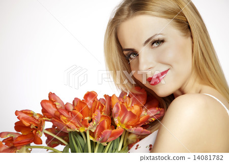 Beautiful blonde girl with the bouquet of tulips isolated on a w 14081782