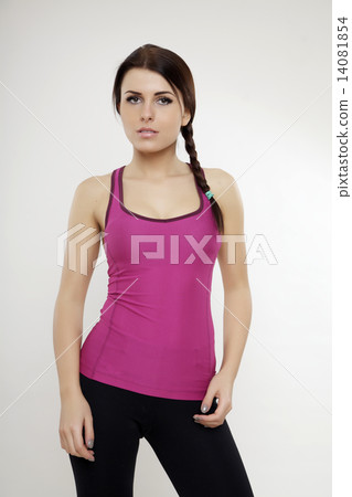sporty woman in violet dress standing and looking on camera sporty woman in violet dress standing and looking on camera 14081854