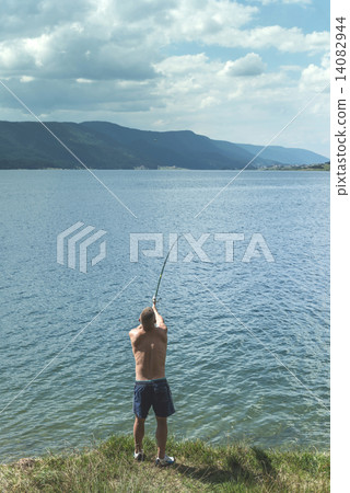 Man on fishing with rod Man on fishing with rod 14082944