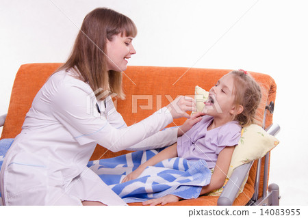The doctor examines the throat Sick little girl in bed The doctor examines the throat Sick little girl in bed 14083955