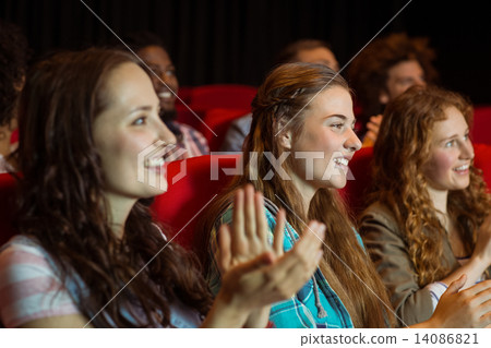 Young friends watching a film Young friends watching a film 14086821