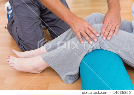 Trainer working with senior woman Trainer working with senior woman 14086860
