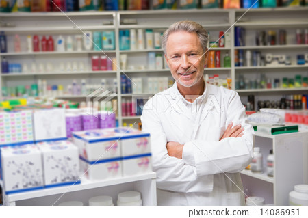 Senior pharmacist smiling at camera 14086951
