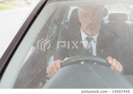 Perplexed man sitting at the wheel Perplexed man sitting at the wheel 14087448