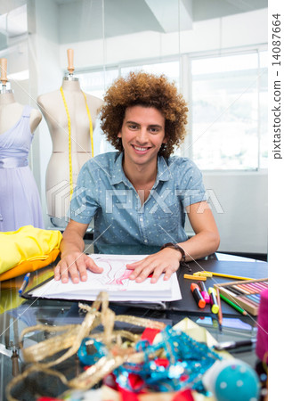 Attractive male fashion designer sketching 14087664