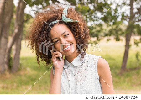 Happy young woman using smartphone Happy young woman using smartphone 14087724