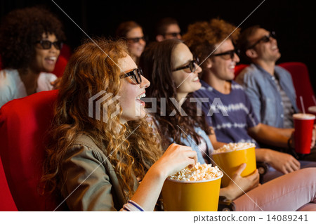 Young friends watching a 3d film 14089241