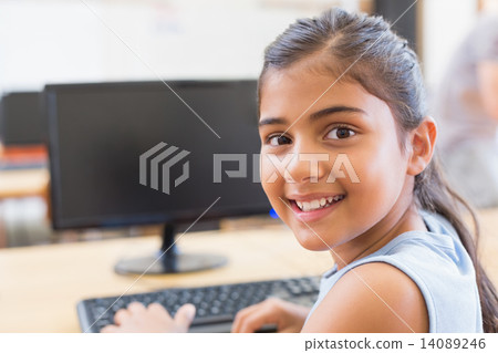 Cute pupil in computer class Cute pupil in computer class 14089246