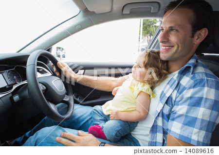 Father playing with baby in drivers seat Father playing with baby in drivers seat 14089616