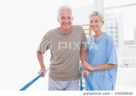Senior man an therapist smiling at camera Senior man an therapist smiling at camera 14089680