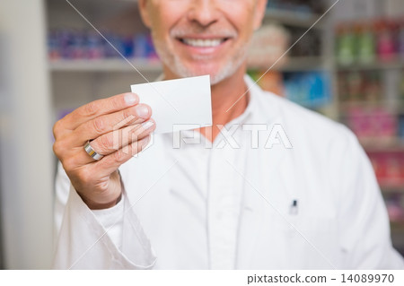 Senior pharmacist holding calling card 14089970