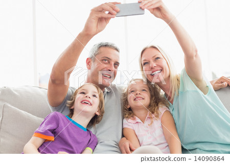 Parents taking selfie with children 14090864