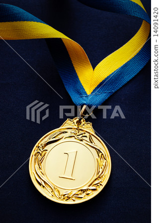 Gold medal on a dark blue background Gold medal on a dark blue background 14091420