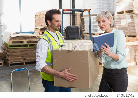 Warehouse worker and manager using tablet pc 14091742