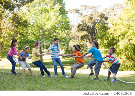 Children having a tug of war in park 14091808