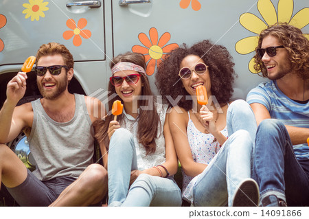 Hipster friends enjoying ice lollies 14091866