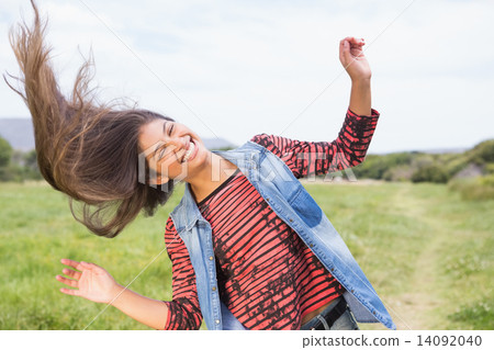 Pretty brunette smiling at camera Pretty brunette smiling at camera 14092040
