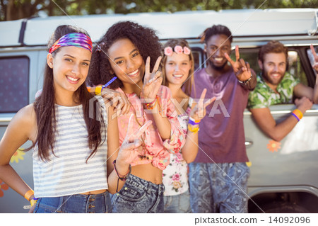 Hipsters hanging out by camper van 14092096