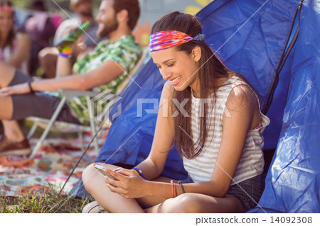 Carefree hipster sending text message Carefree hipster sending text message 14092308