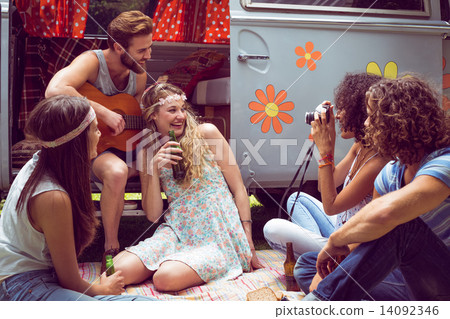 Hipster friends by camper van at festival 14092346