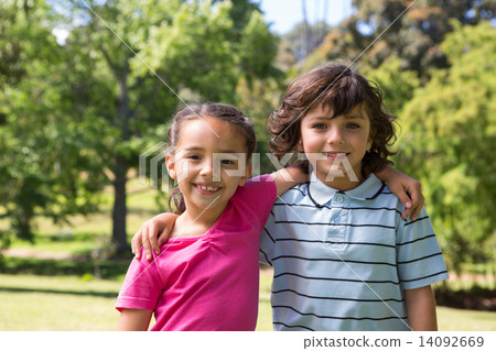 Little siblings smiling at camera Little siblings smiling at camera 14092669