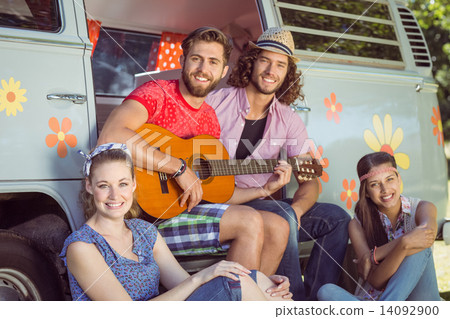 Stock Photo: Hipster friends by their camper van