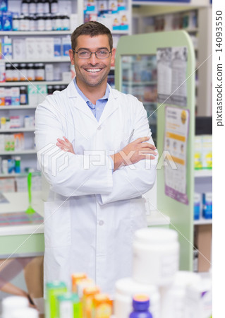 Handsome pharmacist smiling at camera 14093550