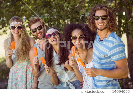 Hipster friends enjoying ice lollies Hipster friends enjoying ice lollies 14094003