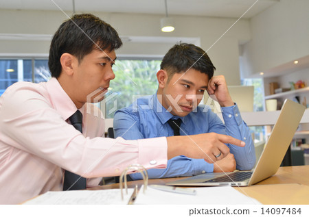 Asian business men discussing project on Laptop Asian business men discussing project on Laptop 14097484
