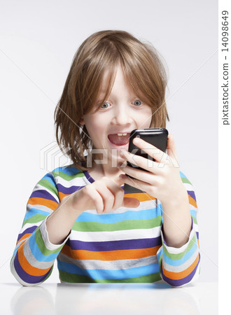 Boy Reading Text Message on Mobile Phone Boy Reading Text Message on Mobile Phone 14098649
