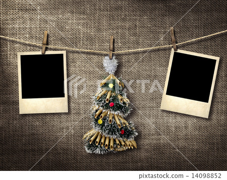 Old style photographs and Christmas tree hanging on a clotheslin Old style photographs and Christmas tree hanging on a clotheslin 14098852