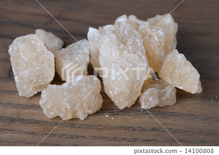 Rock sugar on wooden background Rock sugar on wooden background 14100808