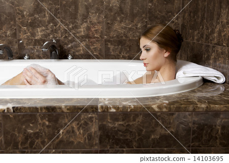 Woman in bath relaxing. Closeup of young woman in bathtub bathin 14103695