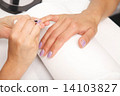 Manicure - Beautiful manicured woman's nails with violet nail po 14103827