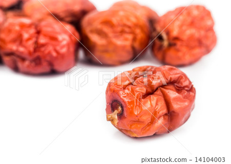 Close up and selective focus on the dried Chinese Red Dates at the foreground 14104003
