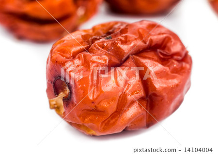 Close up and selective focus on the dried Chinese Red Dates at the foreground 14104004