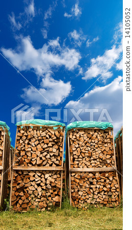 Pile of Chopped Firewood on Blue Sky Pile of Chopped Firewood on Blue Sky 14105052