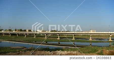 View of town from the river dried up and the bridge, South India, Kerala, Madurai View of town from the river dried up and the bridge, South India, Kerala, Madurai 14108663
