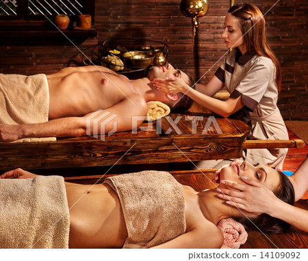Couple having Ayurvedic spa treatment. 14109092