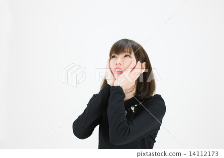 A young lady watching over hitting his hands on his cheeks 14112173