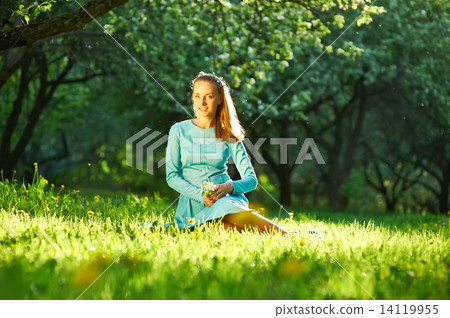 Woman in dress among apple blossoms Woman in dress among apple blossoms 14119955