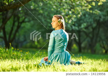 Woman in dress among apple blossoms Woman in dress among apple blossoms 14119956