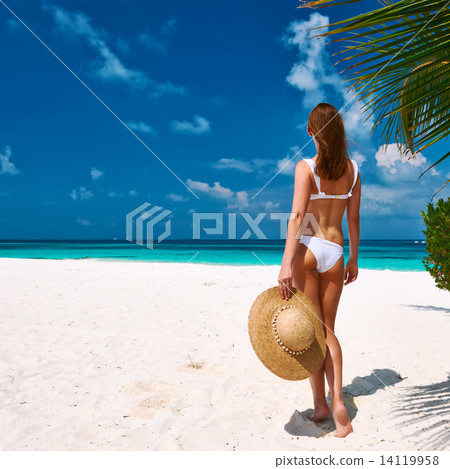 Woman in bikini on a beach at Maldives Woman in bikini on a beach at Maldives 14119958
