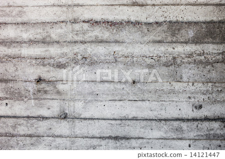 Grey concrete wall with hardened traces of the shuttering moulds 14121447